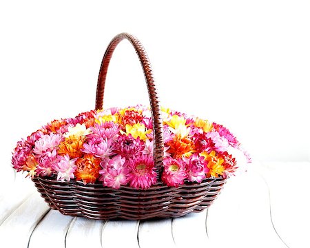 simsearch:400-04348779,k - wicker basket with multicolored flowers on wooden table Stockbilder - Microstock & Abonnement, Bildnummer: 400-07208802