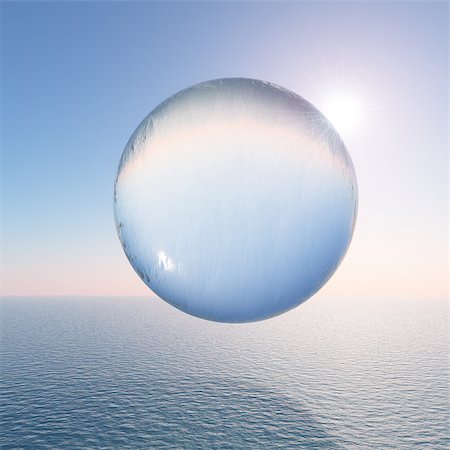 A surreal water sphere hovering above the sea against a clear sky and sun. Photographie de stock - Aubaine LD & Abonnement, Code: 400-07209073