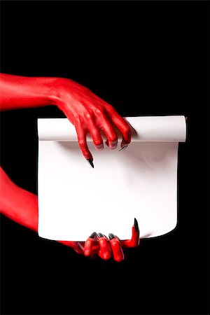 simsearch:400-07209176,k - Red devil hands holding paper scroll, deal with devil concept Photographie de stock - Aubaine LD & Abonnement, Code: 400-07209168