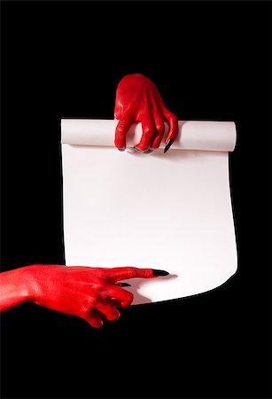 simsearch:400-07209176,k - Red devil hands with black nails holding paper scroll and pointing at signature place Photographie de stock - Aubaine LD & Abonnement, Code: 400-07209169