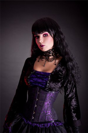 simsearch:400-07209176,k - Portrait of beautiful gothic girl wearing Halloween costume, studio shot on black background Stockbilder - Microstock & Abonnement, Bildnummer: 400-07209172