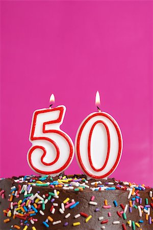 A number candle is lit in celebration of fifty years. Stock Photo - Budget Royalty-Free & Subscription, Code: 400-07209524