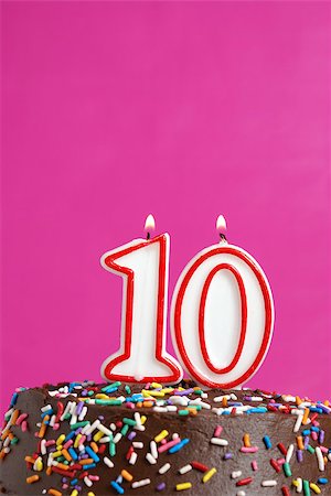 simsearch:400-07462728,k - A number candle is lit in celebration of ten years. Stockbilder - Microstock & Abonnement, Bildnummer: 400-07209532