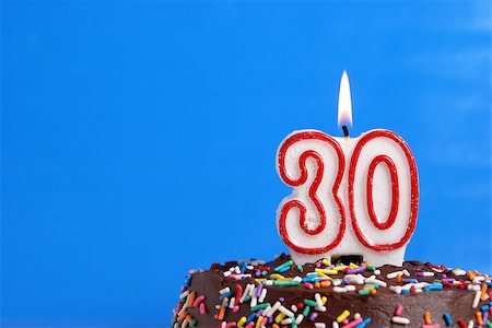 simsearch:400-05695717,k - A number candle is lit in celebration of thirty years. Stock Photo - Budget Royalty-Free & Subscription, Code: 400-07209533