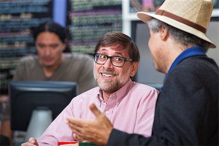 simsearch:400-07042113,k - Smiling man talking with friend in a coffee house Stock Photo - Budget Royalty-Free & Subscription, Code: 400-07209746