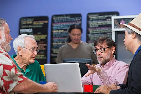 simsearch:400-07042108,k - Mixed group of men in cafe having a conversation Stock Photo - Budget Royalty-Free & Subscription, Code: 400-07209742