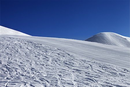 simsearch:400-07217910,k - Ski slope and blue clear sky in nice day. Georgia, ski resort Gudauri. Caucasus Mountains. Stock Photo - Budget Royalty-Free & Subscription, Code: 400-07214424