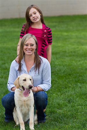 family portrait daughter dog - mom and daughter posing with their pet and best friend outdoors Stock Photo - Budget Royalty-Free & Subscription, Code: 400-07214557