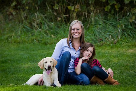 simsearch:400-04681788,k - mom and daughter posing with their pet and best friend outdoors Stockbilder - Microstock & Abonnement, Bildnummer: 400-07214558