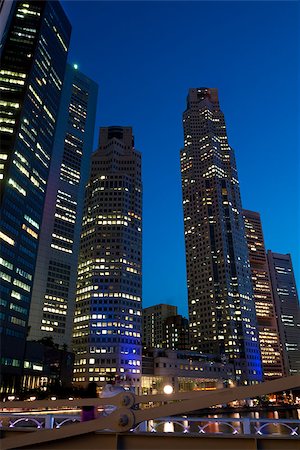 simsearch:400-04968322,k - SINGAPORE - JUNE 23: Singapore downtown skyscrapers at evening, June 23, 2009 Stock Photo - Budget Royalty-Free & Subscription, Code: 400-07214988