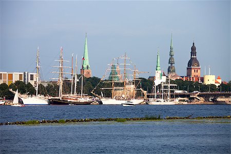 daugava - RIGA, LATVIA - JULY 26: The tall ships races ships in port with traditional Riga skyline in background July 26, 2013 Riga, Latvia. Stock Photo - Budget Royalty-Free & Subscription, Code: 400-07214990
