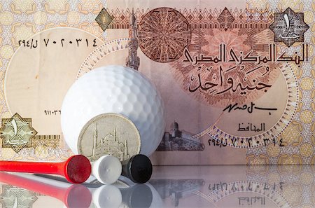simsearch:400-07218310,k - Money and golf equipments in Egyptian national colours Fotografie stock - Microstock e Abbonamento, Codice: 400-07215024