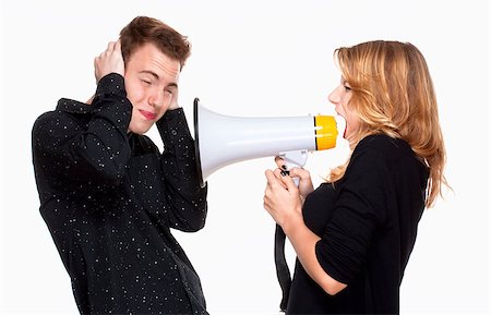 simsearch:400-06763387,k - angray girlfriend screaming in megaphone, boyfriend covering his ears Stock Photo - Budget Royalty-Free & Subscription, Code: 400-07215088