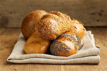 assortment bread (rye, white long loaf, whole-grain cereal bun) Stock Photo - Budget Royalty-Free & Subscription, Code: 400-07215613