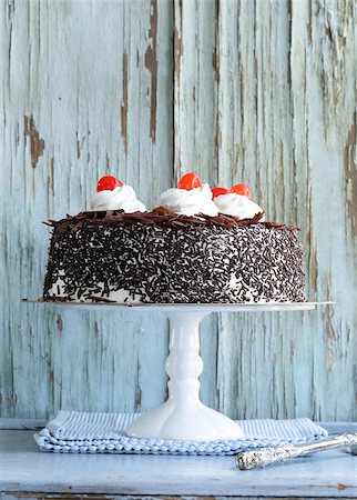 Chocolate cake with cherries and whipped cream (Black Forest) Stock Photo - Budget Royalty-Free & Subscription, Code: 400-07215837