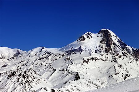 simsearch:400-09079917,k - Mount Kazbek at sun winter day. Caucasus Mountains, Georgia, view from ski resort Gudauri. Stockbilder - Microstock & Abonnement, Bildnummer: 400-07216431