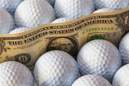simsearch:400-07218310,k - Dollars banknotes and white golf balls in open box in a shop Fotografie stock - Microstock e Abbonamento, Codice: 400-07216583
