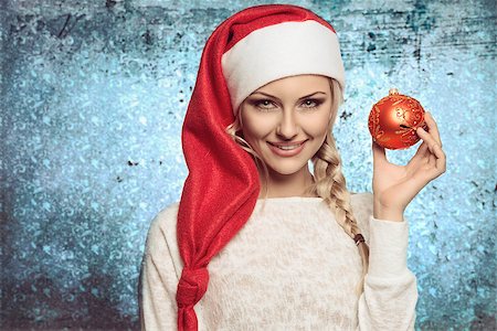 santa christmas hat women - blond girl in white dress with a long christmas hat looking in cameara Stock Photo - Budget Royalty-Free & Subscription, Code: 400-07217135