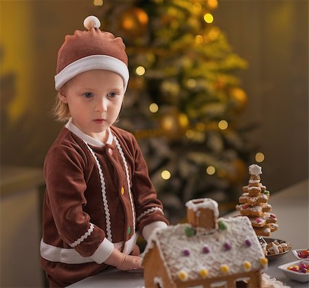 decor home new year - Portrait of baby with christmas cookie house Stock Photo - Budget Royalty-Free & Subscription, Code: 400-07217203