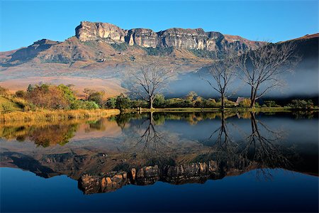 Sandstone mountains with symmetrical reflection in water, Royal Natal National Park, South Africa Stock Photo - Budget Royalty-Free & Subscription, Code: 400-07217593