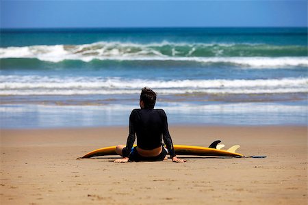 surfing extreme sport - Surfer on a coastline expecting the big wave. Bali Stock Photo - Budget Royalty-Free & Subscription, Code: 400-07217949