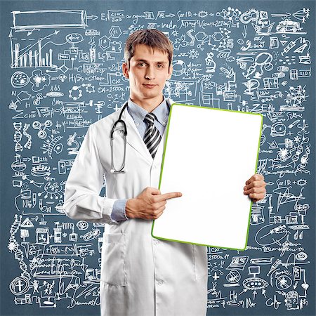 simsearch:400-07216659,k - Doctor man with write board in his hands Photographie de stock - Aubaine LD & Abonnement, Code: 400-07218631