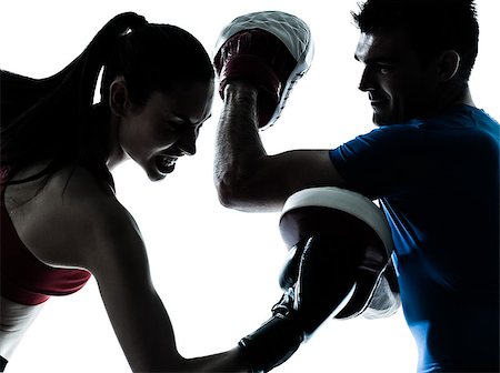 personal trainer man coach and woman exercising boxing silhouette studio isolated on white background Stock Photo - Budget Royalty-Free & Subscription, Code: 400-07218947