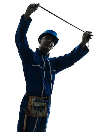 silhouette as carpenter - one caucasian man construction worker Tape Measure silhouette in studio on white background Stock Photo - Budget Royalty-Free & Subscription, Code: 400-07219004