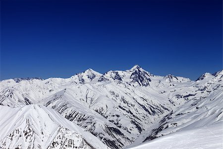 simsearch:400-08671175,k - View on off-piste slope, winter snowy mountains and blue clear sky. Caucasus Mountains, Georgia. Ski resort Gudauri Stock Photo - Budget Royalty-Free & Subscription, Code: 400-07219029