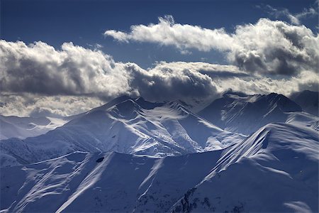 simsearch:400-07211845,k - Evening mountains in sunlight clouds. View from ski resort Gudauri. Caucasus Mountains, Georgia. Stockbilder - Microstock & Abonnement, Bildnummer: 400-07219038