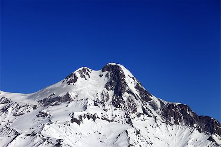 simsearch:400-09079917,k - Top of Mount Kazbek at nice winter day. Caucasus Mountains, Georgia, view from ski resort Gudauri. Stockbilder - Microstock & Abonnement, Bildnummer: 400-07219064