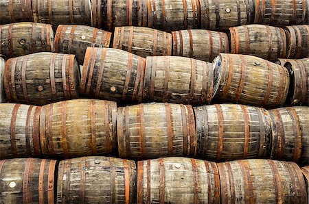 Stacked pile of old whisky and wine wooden barrels and casks Stock Photo - Budget Royalty-Free & Subscription, Code: 400-07219250