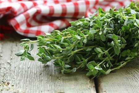 simsearch:400-05381074,k - bunch of fresh green thyme on a wooden table Stock Photo - Budget Royalty-Free & Subscription, Code: 400-07219395