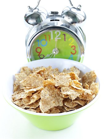 simsearch:400-04626602,k - healthy breakfast - muesli and apple (alarm clock in the background) Stock Photo - Budget Royalty-Free & Subscription, Code: 400-07210058