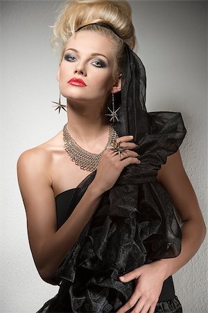 simsearch:400-05164576,k - Halloween portrait of cute blonde girl with dark elegant dress and creative make-up and hair-style. Wearing silver accessories and looking in camera Stock Photo - Budget Royalty-Free & Subscription, Code: 400-07210168
