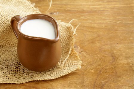 ceramic brown  jug full of milk, rustic style Stock Photo - Budget Royalty-Free & Subscription, Code: 400-07210447