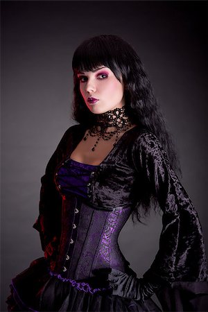 simsearch:400-07209176,k - Portrait of attractive gothic girl in elegant medieval costume, studio shot on black background Stockbilder - Microstock & Abonnement, Bildnummer: 400-07210678