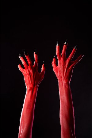 simsearch:400-04680939,k - Red demonic hands with black nails, Halloween theme, studio shot on black background Fotografie stock - Microstock e Abbonamento, Codice: 400-07210670