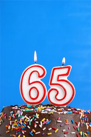 simsearch:400-05695717,k - A number candle is lit in celebration of sixty five years. Foto de stock - Super Valor sin royalties y Suscripción, Código: 400-07211220