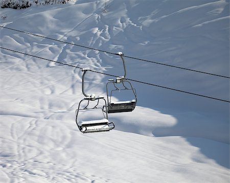 Two chair-lift with snowdrift in sun morning. Caucasus Mountains, Georgia, ski resort Gudauri. Photographie de stock - Aubaine LD & Abonnement, Code: 400-07211382