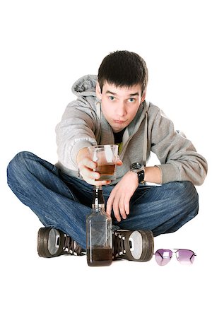 Young man with a glass of whiskey. Isolated Stock Photo - Budget Royalty-Free & Subscription, Code: 400-07211562