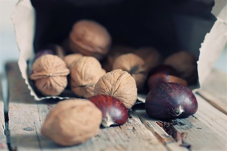 Photo of hazel and walnuts on wooden background Foto de stock - Royalty-Free Super Valor e Assinatura, Número: 400-07211641