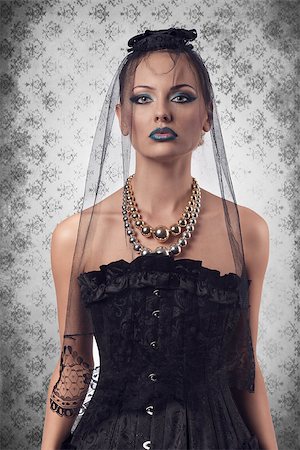 simsearch:400-07223828,k - cute blonde girl wearing gothic clothes, dark veil on the face and bizarre make-up for halloween day Fotografie stock - Microstock e Abbonamento, Codice: 400-07211718