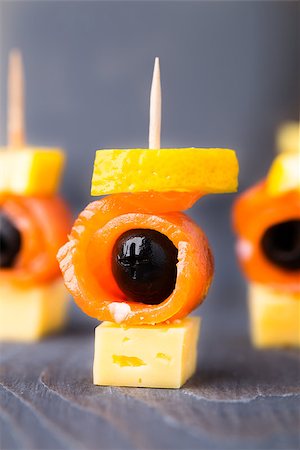 event miniature photography - Canape with delicious salmon, olive and lemon Stock Photo - Budget Royalty-Free & Subscription, Code: 400-07211815