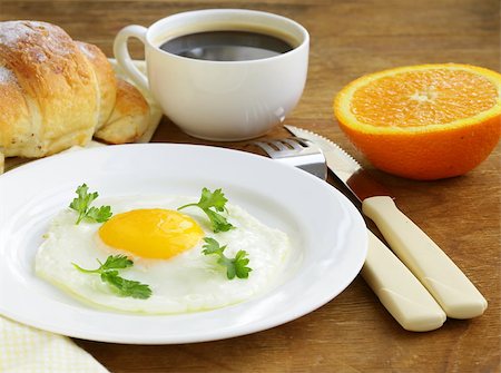 simsearch:400-04414187,k - Continental breakfast - croissant, fried egg, toast and oranges Photographie de stock - Aubaine LD & Abonnement, Code: 400-07212037