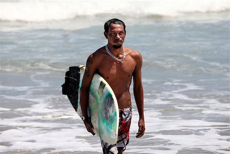 simsearch:400-04476949,k - Surfer on a coastline. Bali, Indonesia Photographie de stock - Aubaine LD & Abonnement, Code: 400-07212735