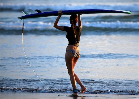 simsearch:400-04476949,k - Woman-surfer with board on a coastline. Bali. Indonesia Photographie de stock - Aubaine LD & Abonnement, Code: 400-07212761