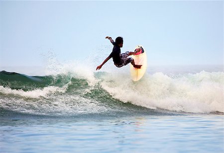 surfing extreme sport - Man-surfer in ocean. Bali. Indonesia Foto de stock - Super Valor sin royalties y Suscripción, Código: 400-07212762