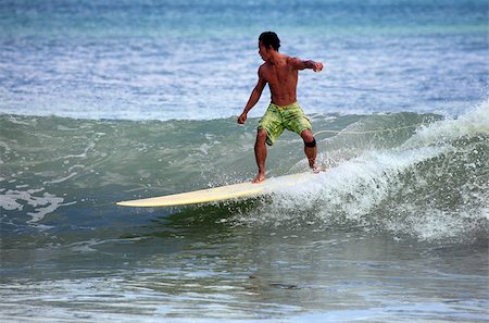 simsearch:400-04476949,k - Man-surfer in ocean. Bali. Indonesia Photographie de stock - Aubaine LD & Abonnement, Code: 400-07212763