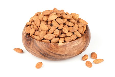 simsearch:400-05309215,k - Heap of peeled almond nuts isolated on white Fotografie stock - Microstock e Abbonamento, Codice: 400-07212892